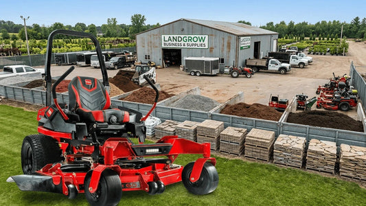 Toro 2000 Series HDX Pro 60-inch zero turn mower shown on grass overlooking a business supply facility with landscaping materials and equipment.