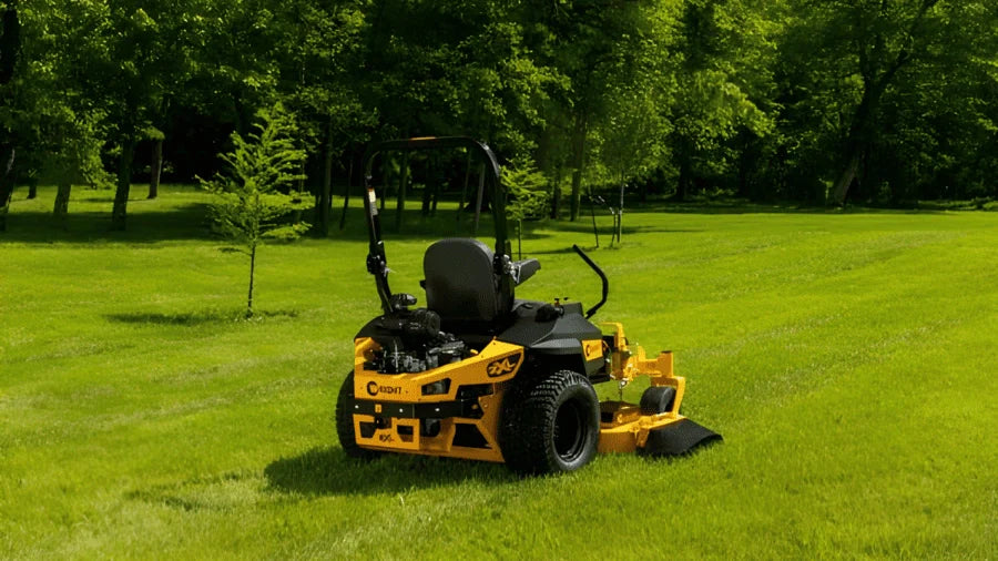 Yellow Wright zero-turn mower parked on lawn, addressing common questions from Somerset, KY homeowners.