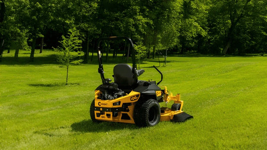 Yellow Wright zero-turn mower parked on lawn, addressing common questions from Somerset, KY homeowners.